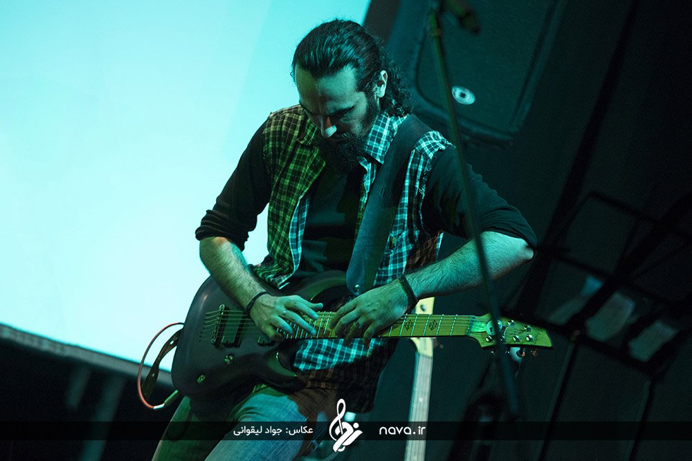 AndishiA on stage in blue light